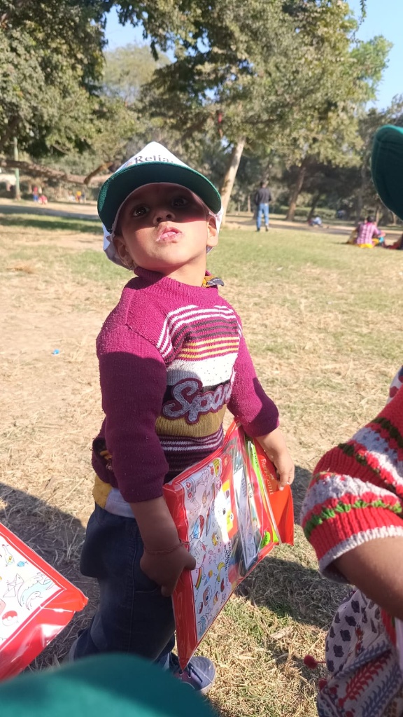 Child with Reliance Foundation cap and kit